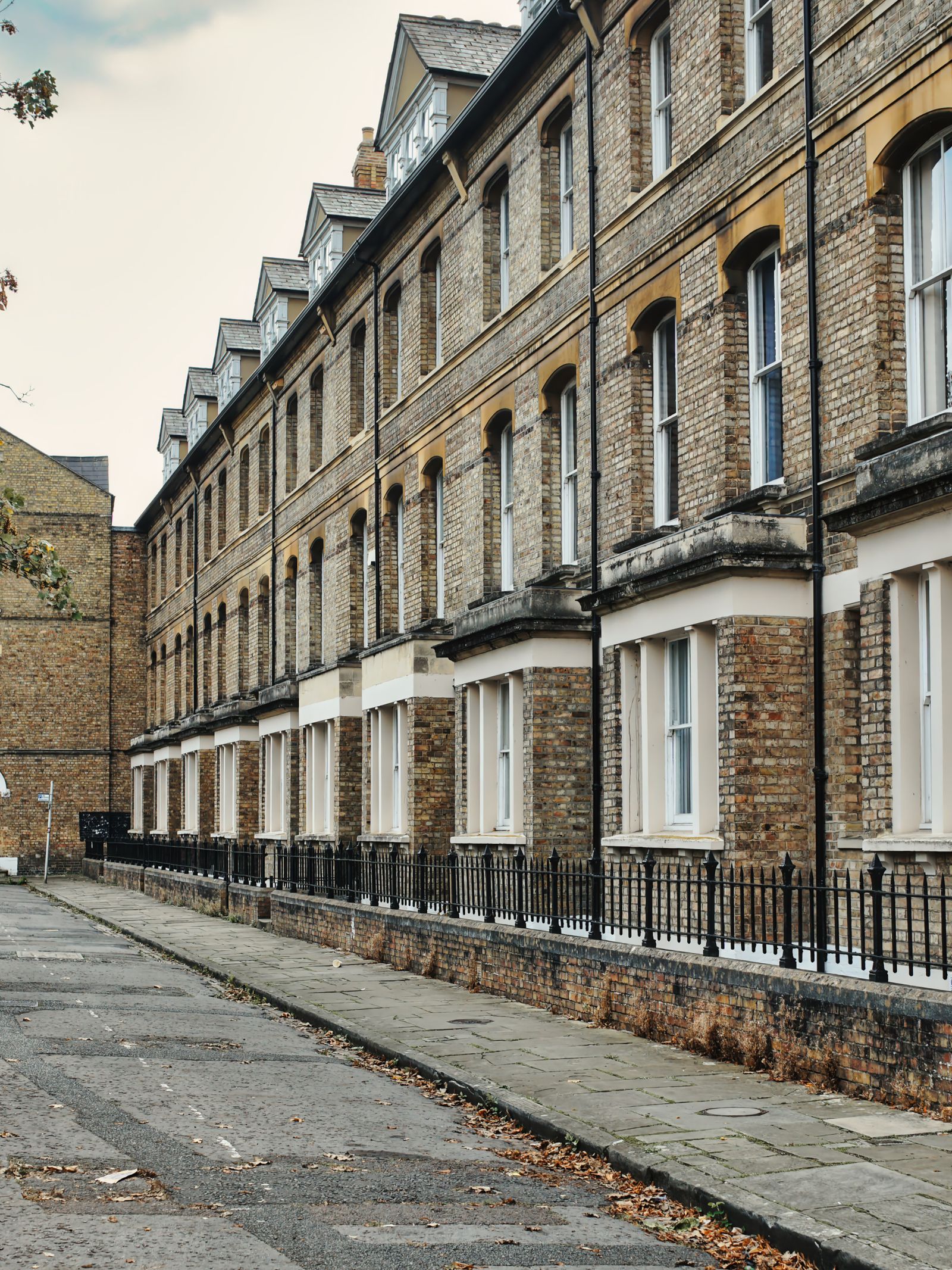 Roofline, gutters and downpipes on a brick terrace